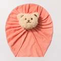 Detailed view of pink knitted baby hat featuring a 3D plush bear and soft texture - Flesh Pink