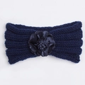 Detail of navy knit baby headband showing the textured weave and handmade satin flower - Navy Blue