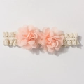 Detailed close-up of cream lace headband with two soft peach chiffon flower decorations - Flesh Pink