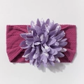 Close-up of rose red ribbed nylon baby headband with layered purple floral decoration - Deep Purple