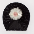 Detail of baby velvet hat with large white lace flower and decorative pink center - Black