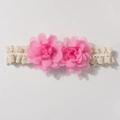 Detailed view of pink chiffon double flowers on an ivory lace baby headband for infants - Pink
