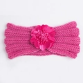 Detail of rose red knitted baby headband featuring a large satin layered flower ornament - Rose Red