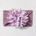 Detail of light purple ribbed elastic baby headband with a large polka dot flower ornament - Taro Purple