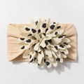Close-up of baby nylon headband with large white cream flower and black heart print - Beige Coffee