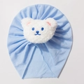 Light blue baby turban hat featuring a soft white plush bear patch for infants - Light Blue