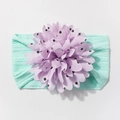 Detail of baby nylon headband featuring a purple polka dot 3D flower and mint green rib band - Mint Green