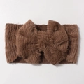 Detail view of plush brown baby headband featuring a soft fluffy bow texture for warmth - Coffee
