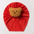 Breathable red cotton knit baby beanie featuring a cute plush bear decoration - Orange