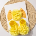 Baby gift set with bright yellow knitted headband and socks featuring large 3D fabric flowers - Khaki/Earth Yellow