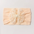 Detailed flat lay of peach baby elastic headband with white lace floral bow detail - Nude Pink