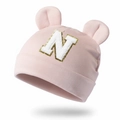 Detail of pink modal baby hat with bear ears and sequined letter N embroidery - Dusky Pink