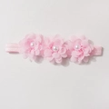 Détails de fleurs en mousseline rose et perles sur un bandeau élastique pour bébé - Rose Clair