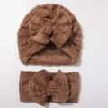 Close-up of the warm caramel brown plush texture on the baby hat and headband set - Coffee