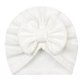 Detail of baby turban featuring a large bow and white cable knit texture patterns - White