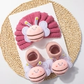 Detail of pink knitted baby hat and socks set featuring 3D cartoon bee plush appliques - Dark Dusty Rose