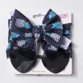 Détail du bandeau bébé motif ananas et lunettes de soleil coeur noir sur carton de présentation - Léopard Ananas Cœur Noir (M)