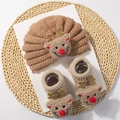 Close-up of knit baby hat and socks set with 3D cartoon reindeer for Christmas - Camel Antler Style H