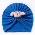 Detailed knit texture of royal blue baby turban hat with plush puppy dog ornament - Sapphire Blue