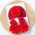 Detail of red infant cap with pleated flower and matching floral socks set - Red