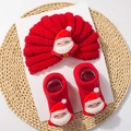 Detail of red knitted Christmas baby hat and socks set with 3D plush Santa Claus decorations - Red Santa Style A