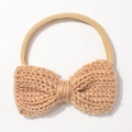 Close-up of khaki knit bow headband with fine texture and high elastic band detail - Coffee