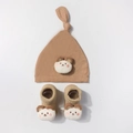 Close-up of baby knit hat and socks set with 3D plush bear head details in khaki - Coffee