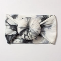 Detail of soft tie-dye nylon baby headband with unique donut knot and cloudy texture - Gray