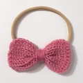 Detailed texture of pink knit bow on khaki elastic nylon baby headband for infants - Dusky Pink