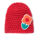 Detail of red crochet baby beanie featuring a colorful textured flower applique patch - Red
