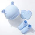 Close-up of light blue newborn baby hat, mittens, and booties set with soft bear ears - Blue