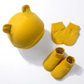 Three-piece baby set in ginger cotton including hat with ears, mittens, and soft booties - Turmeric