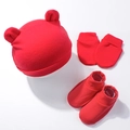 Detailed view of red newborn knit set with bear ear hat, mittens and booties - Red