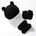 Detailed view of 3-piece newborn set with bear ear knit hat, mittens and socks in black - Black