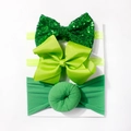 Dettaglio del set di fasce verdi per neonati con paillettes, fiocco in gros-grain e stile donut - Verde