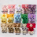 Detailed grid view of 15-color sets featuring baby floral headbands and matching knit socks - Multicolor Combo