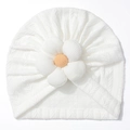 Close-up of white cable knit baby hat featuring a 3D yellow sunflower embellishment - White