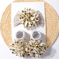 Detail of baby headband and socks set with large beige fabric flowers and black hearts - Gray