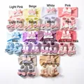 Detail of baby headband and sock set with cute rabbit bow accents in ten soft colors - 2-Piece Set (1 Headband + 1 Pair of Socks) / Mixed Colors