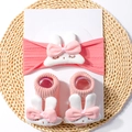 Detailed view of pink ribbed baby headband and socks set with plush bunny decor - 2-Piece Set (1 Headband + 1 Pair of Socks) / Dark Mauve