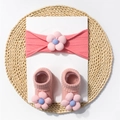 Detail of pink ribbed baby headband and socks set featuring soft fabric flower ornaments - Dusty Pink