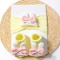 Close-up of yellow baby headband and socks set featuring soft plush 3D bunny details - Beige