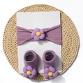 Detailed macro view of lilac baby headband and socks set with 3D knitted flower accents - Taro Purple