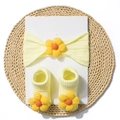 Baby headband and socks set in yellow ribbed knit with floral 3D decor on a straw mat - Beige