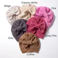 Close-up of knit baby turban hats with bow details in six assorted neutral colors - 6 Colors Mixed