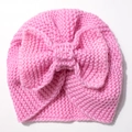 Pink knit baby turban hat with a large bow decoration for autumn and winter warmth - Pink