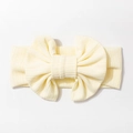 Detalle de la diadema para bebé de punto acanalado amarillo claro con gran lazo - Beige