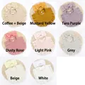 Detail of soft cotton baby bib and bow headband set in various Morandi earth tones - 8 Colors Mixed
