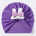 Detailed view of purple knitted baby turban hat with a cute bunny and pink bow - Purple