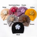 Detail showing seven waffle knit baby turbans with decorative fabric flowers in various colors - Mixed 7 Colors